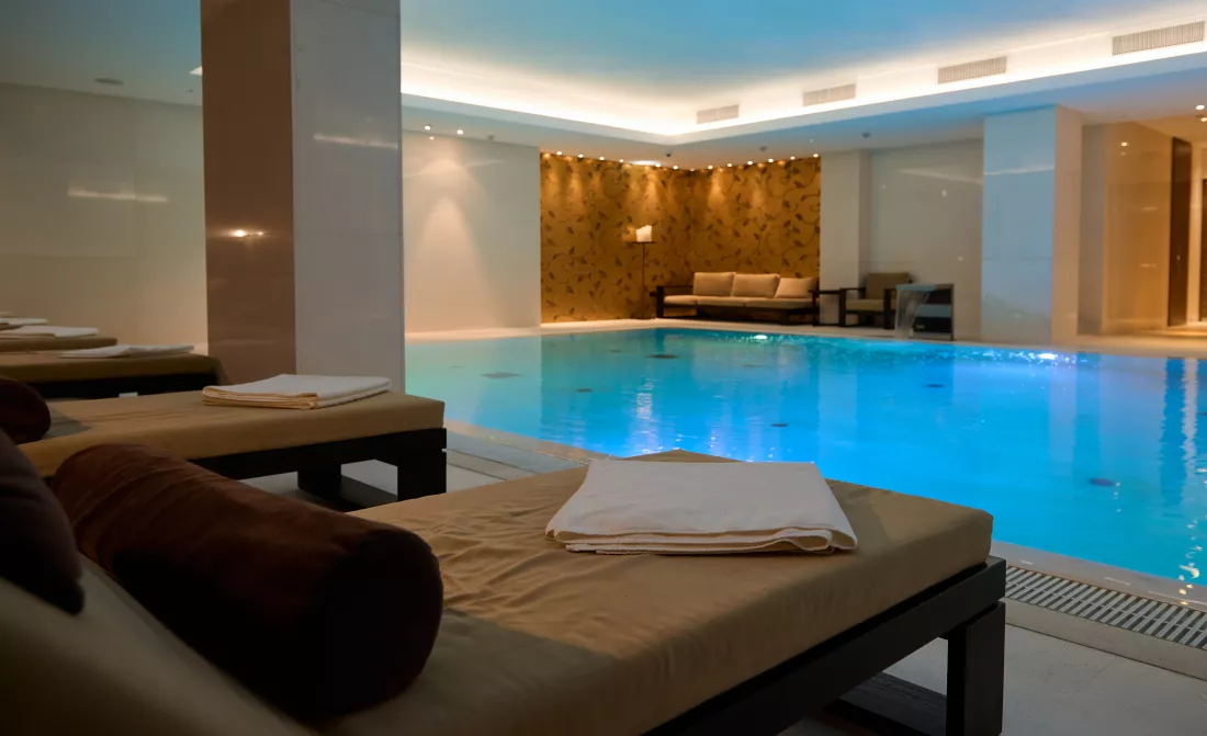 loungers-lounge-area-with-thermal-swimming-pool-view-beautiful-luxurious-interior-health-wellness-spa-resort